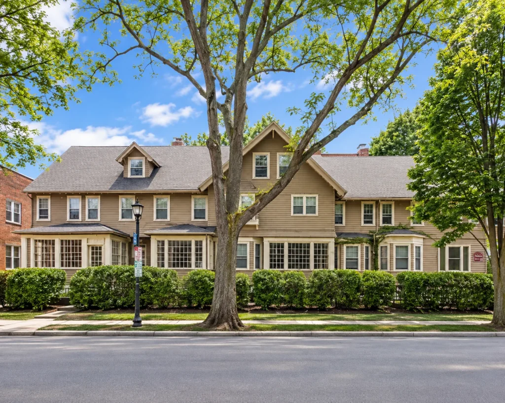 Row of connected residences behind a trimmed hedge at 246-254 Park Ave. in Rochester, NY