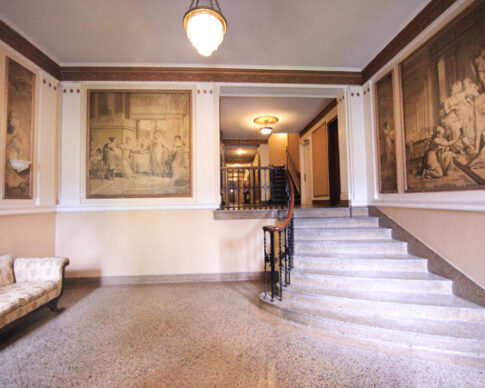 Interior lobby with orignal murals and marble staircase